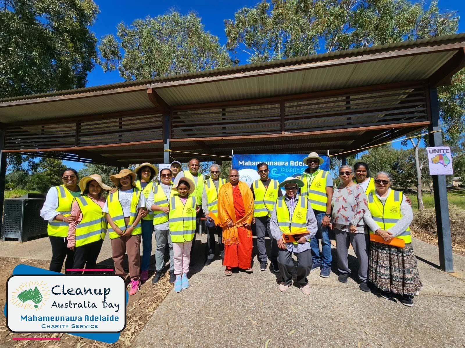 MBMA community volunteers gathered in high-visibility vests during a cleanup activity.